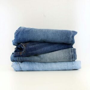a stack of jeans sitting on top of each other